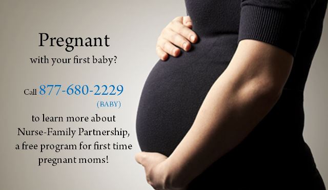 Pregnant woman holding belly.
